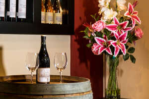 wine glasses and a vase of flowers at orestone manor wine glasses and a vase of flowers at orestone manor